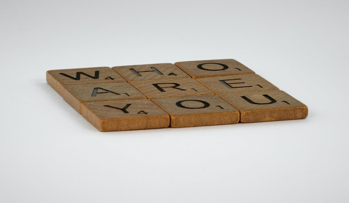 A block of wood that reads 'who are you'.