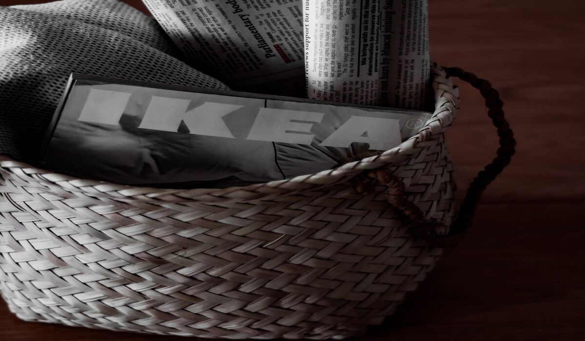 A basket with an IKEA book inside.