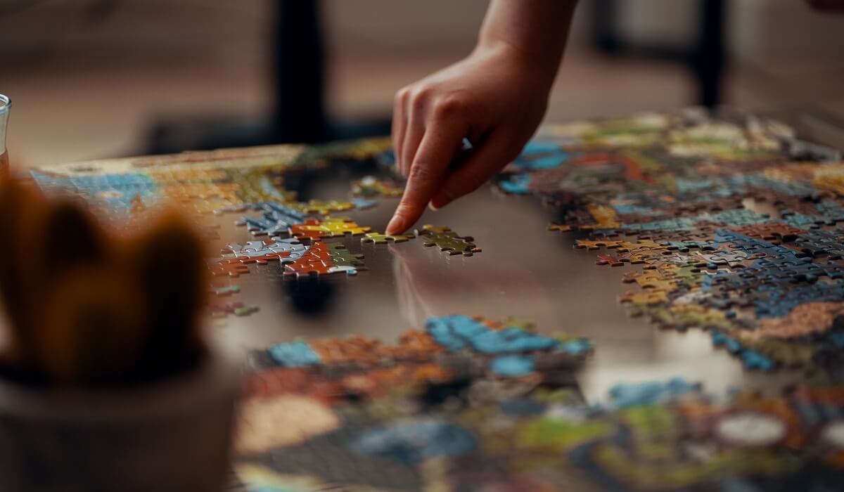 A person doing a puzzle.